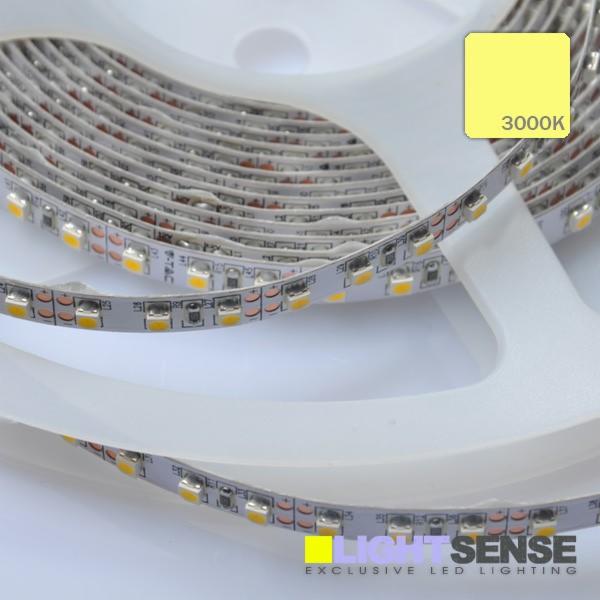 Zwinięta taśma LED SMD3528 z diodami emitującymi białe ciepłe światło 3000K, nawinięta na przezroczystą szpulę, widoczne logo producenta.