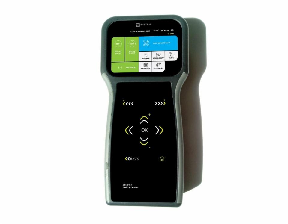 Urządzenie kalibracyjne VRS-Pro 1 Fuel calibrator marki Woltium z ekranem dotykowym, widoczne ikony menu i przyciski nawigacyjne.