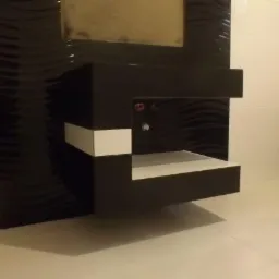 Nowoczesna łazienka z czarno-białymi płytkami o falistej strukturze, wisząca szafka pod umywalkę z białymi elementami, minimalistyczny design.