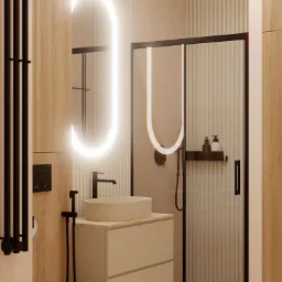 Nowoczesna łazienka z owalnym lustrem podświetlanym LED, umywalką nablatową na szafce z szufladami, kabiną prysznicową z czarną ramą i grzejnikiem drabinkowym w kolorze czarnym.