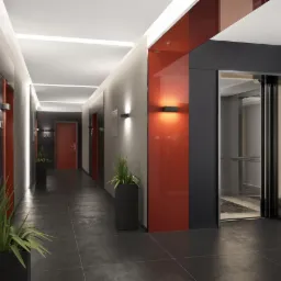 Nowoczesny korytarz w budynku apartamentowym z czerwonymi akcentami, roślinami w donicach, windą i napisem 'PARTER' na ścianie.