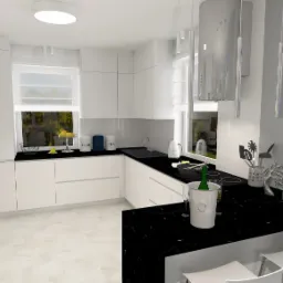 Wizualizacja nowoczesnej kuchni z białymi szafkami i czarnym blatem, oświetlona lampą sufitową, z widokiem na okno i abstrakcyjny obraz na ścianie.