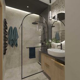 Studio Metr Na 2 - Projektowanie Wnętrz i Mebli - Nowoczesna łazienka z kabiną typu walk-in, umywalką nablatową i okrągłym lustrem z podświetleniem LED. Uwagę zwraca czarna armatura i minimalistyczny design.