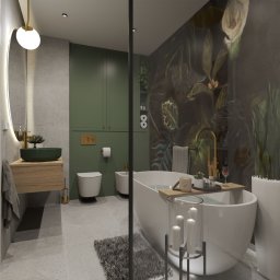 Studio Metr Na 2 - Projektowanie Wnętrz i Mebli - Wizualizacja łazienki z wanną na tle ściany z motywem roślinnym, umywalką w kolorze butelkowej zieleni i okrągłym lustrem z podświetleniem LED.