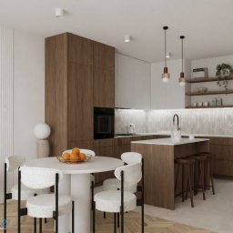 Studio Metr Na 2 - Projektowanie Wnętrz i Mebli - Nowoczesna kuchnia z wyspą i okrągłym stołem. Drewniane szafki, białe ściany z dekoracyjnymi panelami. Na stole misa z pomarańczami. Minimalistyczne lampy wiszące.