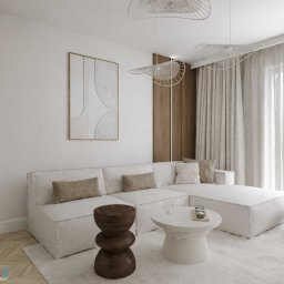 Studio Metr Na 2 - Projektowanie Wnętrz i Mebli - Jasne wnętrze salonu z modułową sofą, drewnianym stolikiem i abstrakcyjnym obrazem na ścianie. Minimalistyczny design z akcentami naturalnego drewna i roślin.