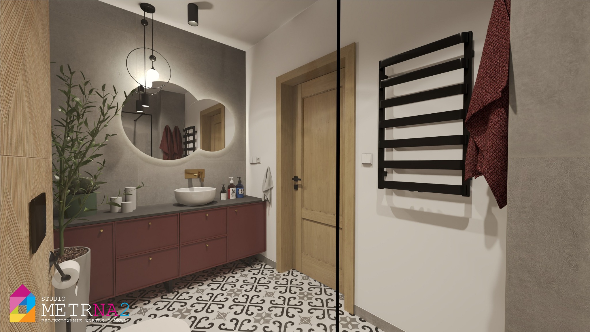 Nowoczesna łazienka z burgundową szafką pod umywalką, okrągłym lustrem z podświetleniem i wzorzystą podłogą. Na ścianie grzejnik drabinkowy z ręcznikiem.
