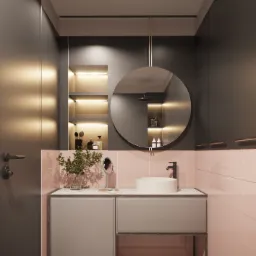 Nowoczesna łazienka z okrągłym lustrem, umywalką nablatową i różowymi płytkami, oświetlona półka z kosmetykami w tle, wzorzysta podłoga.