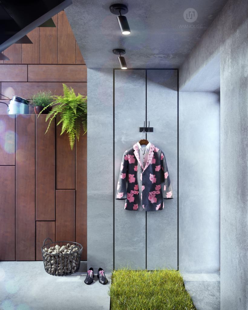 Nowoczesny przedpokój w Chojnicach z drewnianą ścianą, roślinami doniczkowymi, designerskim oświetleniem i awangardowym płaszczem w świnki zawieszonym na wieszaku.