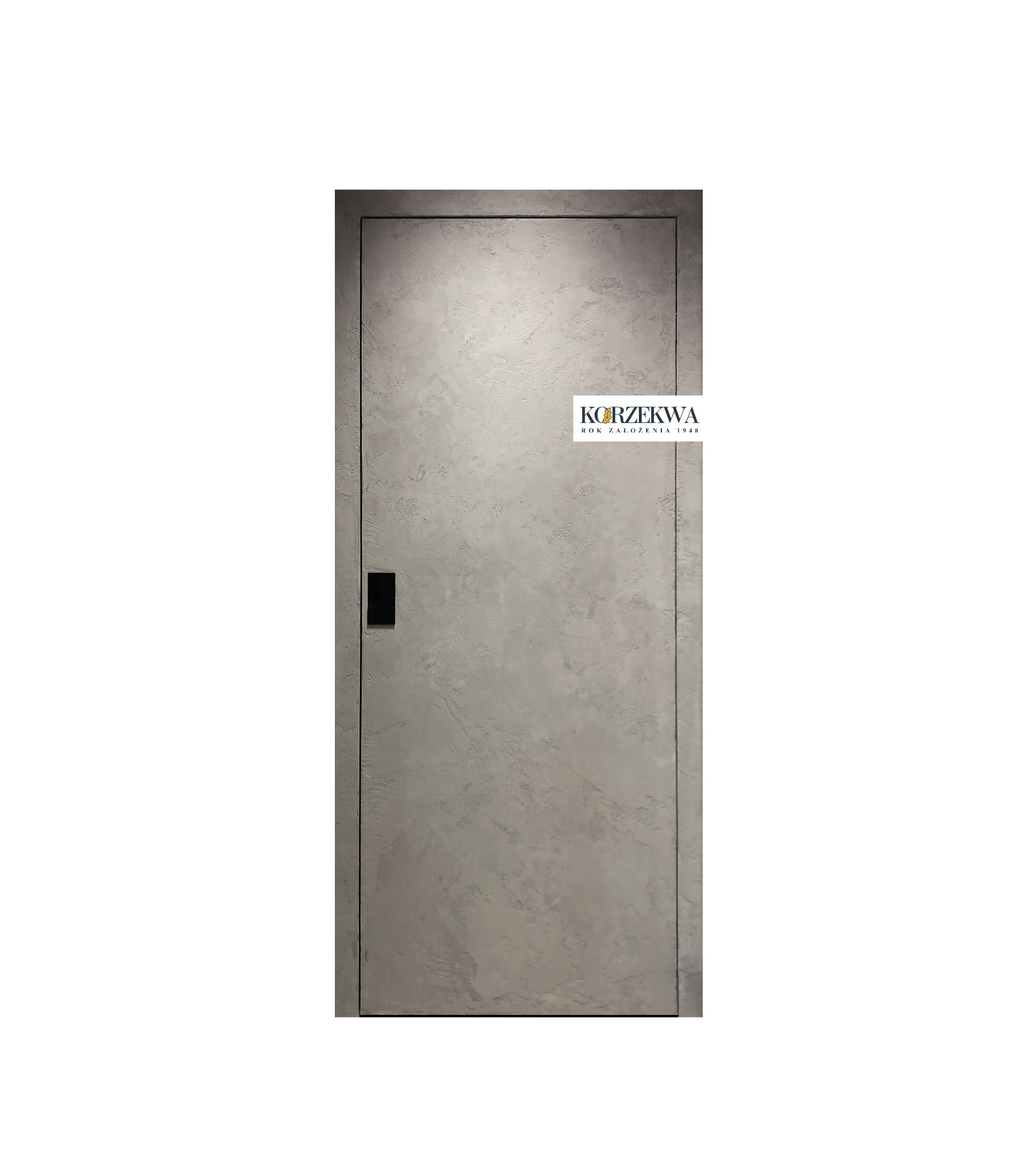 Szare skrzydło z ukrytą ościeżnicą i czarną klamką, widoczne logo producenta w prawym górnym rogu.
