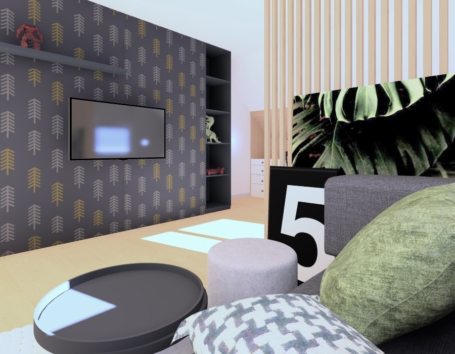 Wizualizacja pokoju dziecięcego z tapetą w motyw drzewek, telewizorem na ścianie, półkami z zabawkami oraz okrągłym stolikiem i poduszkami na pierwszym planie.