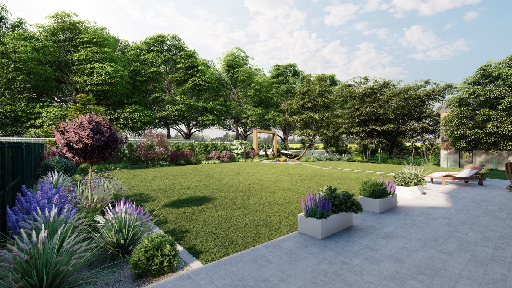 Przestronny ogród z równo przystrzyżonym trawnikiem, ozdobnymi rabatami kwiatowymi, drewnianą huśtawką i strefą relaksu z leżakiem na wyłożonym płytami tarasie.