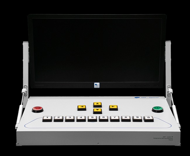 Aparat diagnostyczny SDP-System z ekranem i przyciskami oznaczonymi 'TAK' i 'NIE', używany w psychologii i psychiatrii.