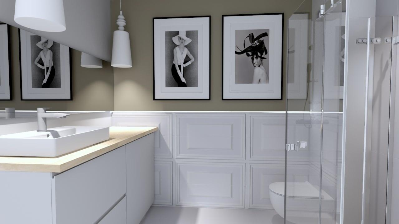 Nowoczesna łazienka z białymi szafkami pod umywalką z drewnianym blatem, kabiną prysznicową i czarno-białymi portretami w ramkach na ścianie.