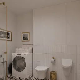 Biała łazienka z pralką, wiszącą toaletą i pisuar, złote akcenty, czarno-biała podłoga w geometryczny wzór, obrazy w złotych ramach na ścianie, minimalistyczny styl.