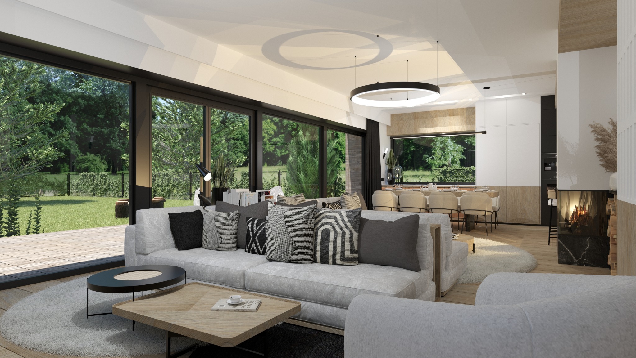 Jasne, przestronne wnętrze z dużym oknem na ogród, szarą sofą z dekoracyjnymi poduszkami, okrągłym dywanem i kominkiem z paleniskiem.