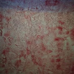 Tekstura ściany z efektem dekoracyjnym w odcieniach bieli i czerwieni, imitująca wzór falisty.