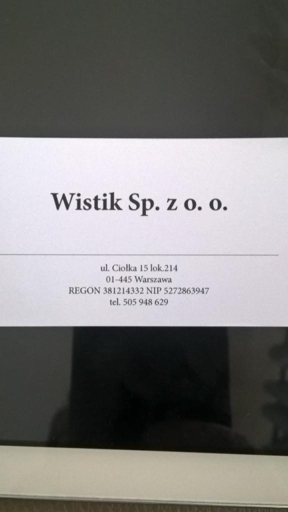 Wizytówka firmy Wistik Sp. z o.o. z Warszawy. Adres, REGON, NIP i numer telefonu na białym tle z czarnym tekstem, widoczne w kadrze.