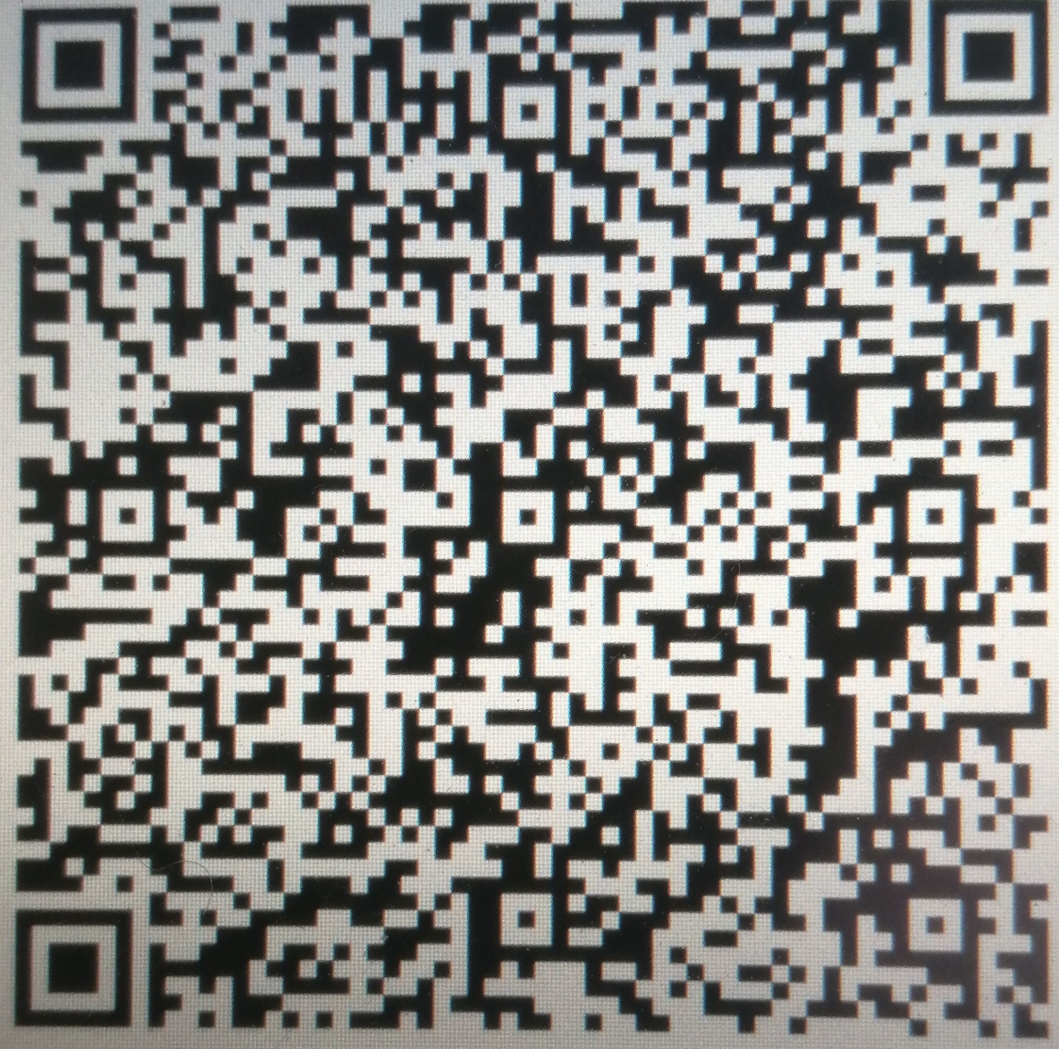 Czarno-biały kod QR z widocznymi kwadratami i wzorami, potencjalnie zawierający dane kontaktowe lub link do strony internetowej firmy.