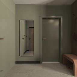 Studio Dobre Miejsce Sylwia Malewicz - Nowoczesny przedpokój w oliwkowych odcieniach z minimalistyczną ławką, lustrem i drewnianymi akcentami. Widoczne drzwi i torebka na wieszaku.