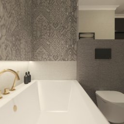 Studio Dobre Miejsce Sylwia Malewicz - Elegancka łazienka w odcieniach szarości z wanną, złotą armaturą i wzorzystymi płytkami. Minimalistyczny design z oświetleniem LED.