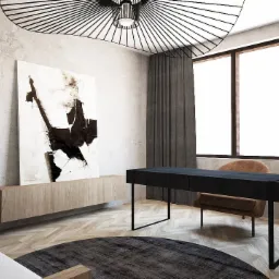 Nowoczesne biuro domowe z czarnym biurkiem, abstrakcyjnym obrazem, rośliną doniczkową i okrągłym dywanem na parkiecie w jodełkę.