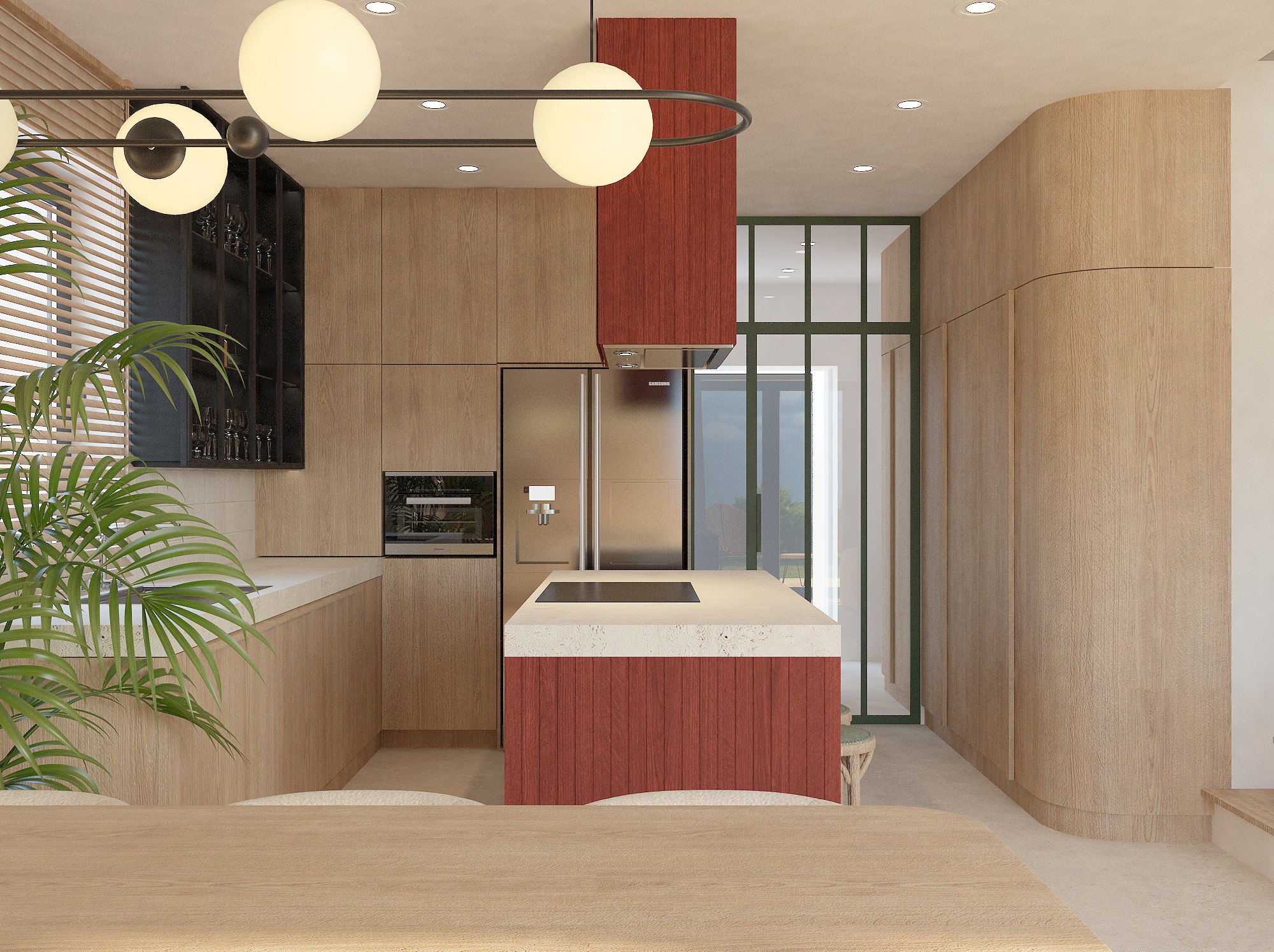 Nowoczesna kuchnia z drewnianymi szafkami, wyspą z czerwonym akcentem i okrągłymi lampami. Roślina w rogu dodaje świeżości. Widok na przeszklone drzwi.