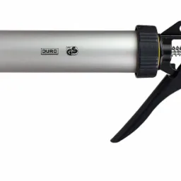 Pistolet do silikonu marki DURG z certyfikatem VPA GS, srebrna tuba i czarne elementy mechaniczne, widoczne sprężyny i mechanizm spustowy.