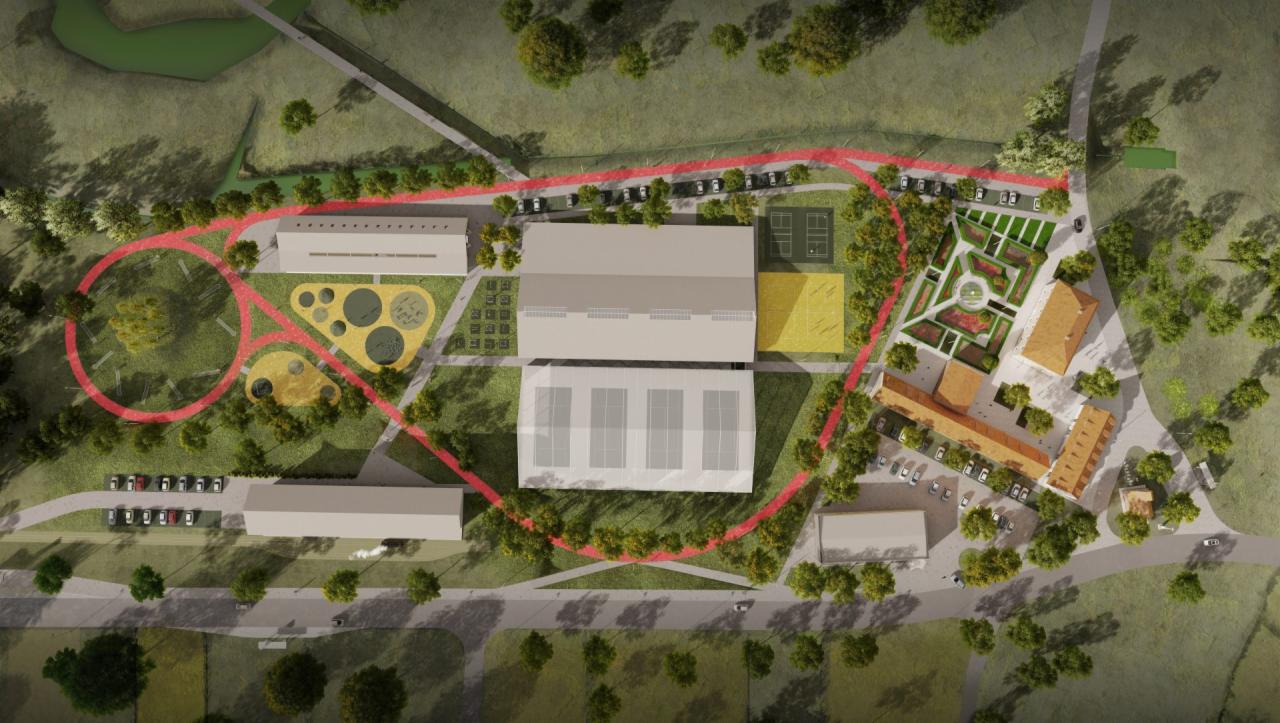 Plan zagospodarowania terenu Kompleksu Stodoły w Rybniku z widokiem z lotu ptaka, prezentujący budynki, parkingi, plac zabaw, kort tenisowy, park i otaczającą zieleń.