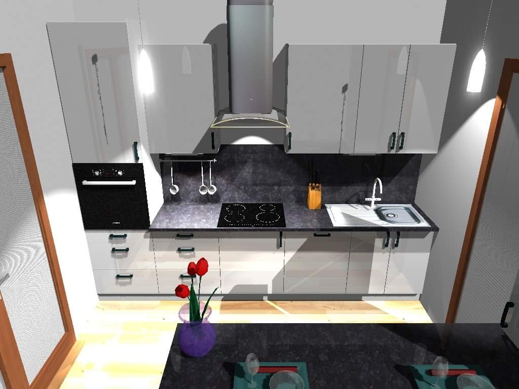 Wizualizacja nowoczesnej kuchni z białymi, błyszczącymi frontami szafek, czarnym blatem i płytą grzewczą, oraz stalowym okapem. Na pierwszym planie fioletowy wazon z czerwonymi tulipanami...
