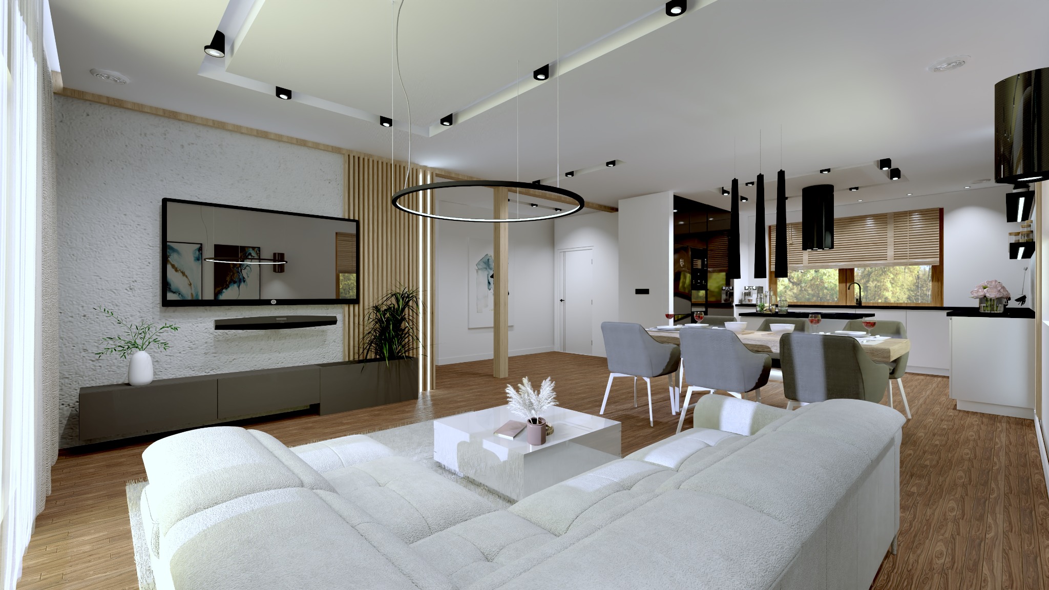 Wnętrze przestronnego salonu z aneksem kuchennym, oświetlenie punktowe, biała sofa modułowa, stół z szarymi krzesłami, wisząca lampa w kształcie okręgu, telewizor na ścianie z fakturą.