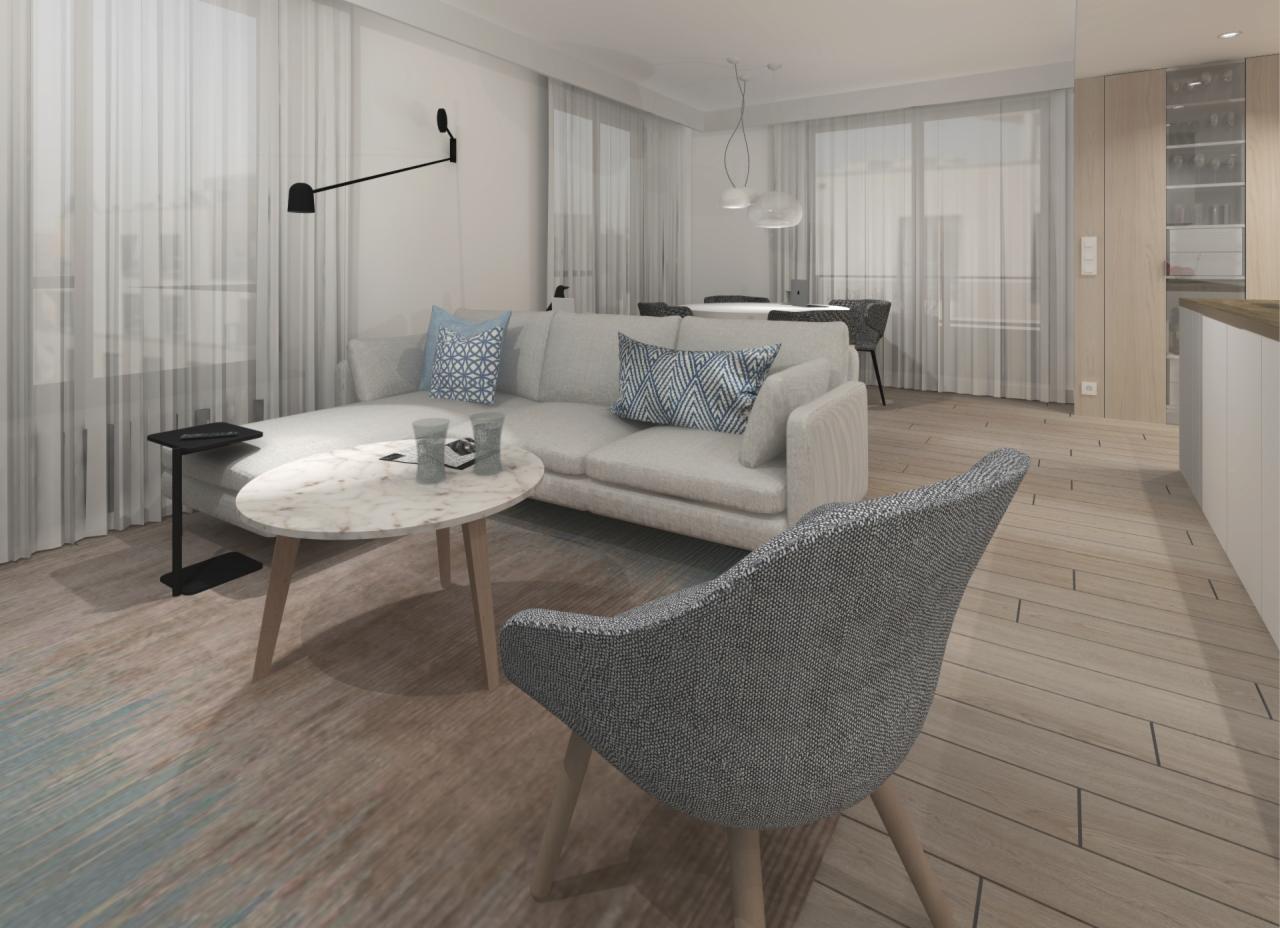 Jasny salon z narożną sofą, marmurowym stolikiem kawowym, szarą tapicerowaną krzesłem i drewnianą podłogą, oświetlony przez minimalistyczną lampę ścienną, z widokiem na jadalnię w tle.