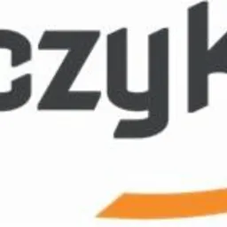 Logo firmy Włóczykiji przedstawiające sylwetkę czarodzieja w kapeluszu, lecącego na pomarańczowej smudze.