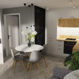 Wizualizacja małej kuchni z okrągłym stołem, czarną tablicą kredową z menu i drewnianymi blatami.