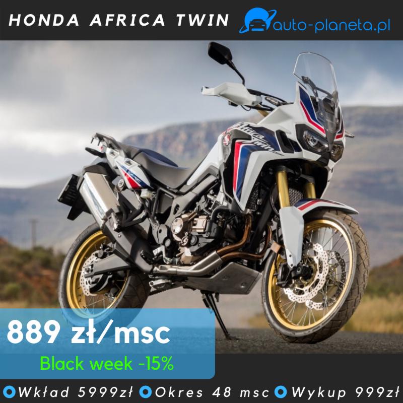 Motocykl Honda Africa Twin z białym i czerwono-niebieskim malowaniem, złote felgi, prezentowany na tle górskim, z widoczną ofertą cenową i logo auto-planeta.pl.