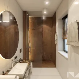 Nowoczesna łazienka z okrągłym lustrem podświetlanym LED, umywalką nablatową na marmurowym blacie i kabiną prysznicową typu walk-in z brązowymi panelami ściennymi.