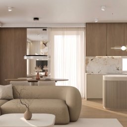 TULLAHOME Sp. z o.o. - Nowoczesny salon z beżową, modułową sofą, okrągłym stolikiem kawowym i jadalnią. Otwarta kuchnia z drewnianymi szafkami, marmurowym blatem i ryflowaną wyspą. Jasne wnętrze z listwami LED...