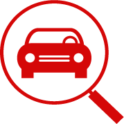 Czerwona ikona samochodu w powiększeniu, symbolizująca wyszukiwanie lub auto złom.