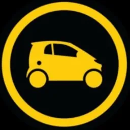 Żółty ikona małego samochodu w czarnym okręgu z żółtą obwódką, stylizowany na uproszczony symbol graficzny.