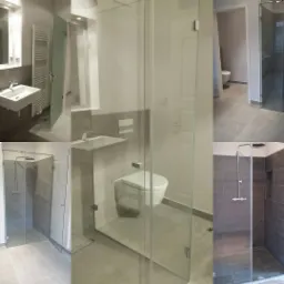 Nowoczesna łazienka z kabiną prysznicową ze szkła hartowanego, umywalką nablatową i wiszącą toaletą, utrzymana w szaro-białej kolorystyce z minimalistycznym designem.