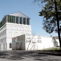 Wizualizacja elewacji budynku biurowego z elementami zieleni na dachu, widok z ulicy z zaparkowanymi samochodami.