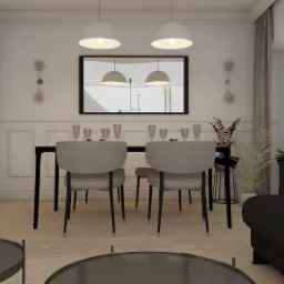 Wnętrze domu jednorodzinnego w Wierzbicy: jadalnia z drewnianym stołem, krzesłami tapicerowanymi w kolorze szarym, okrągłymi lampami wiszącymi i dekoracjami roślinnymi, widok z salonu.