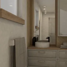 Wizualizacja łazienki z okrągłą umywalką nablatową, czarną armaturą i szarą szafką z szufladami, widok na prysznic wyłożony białą cegiełką.