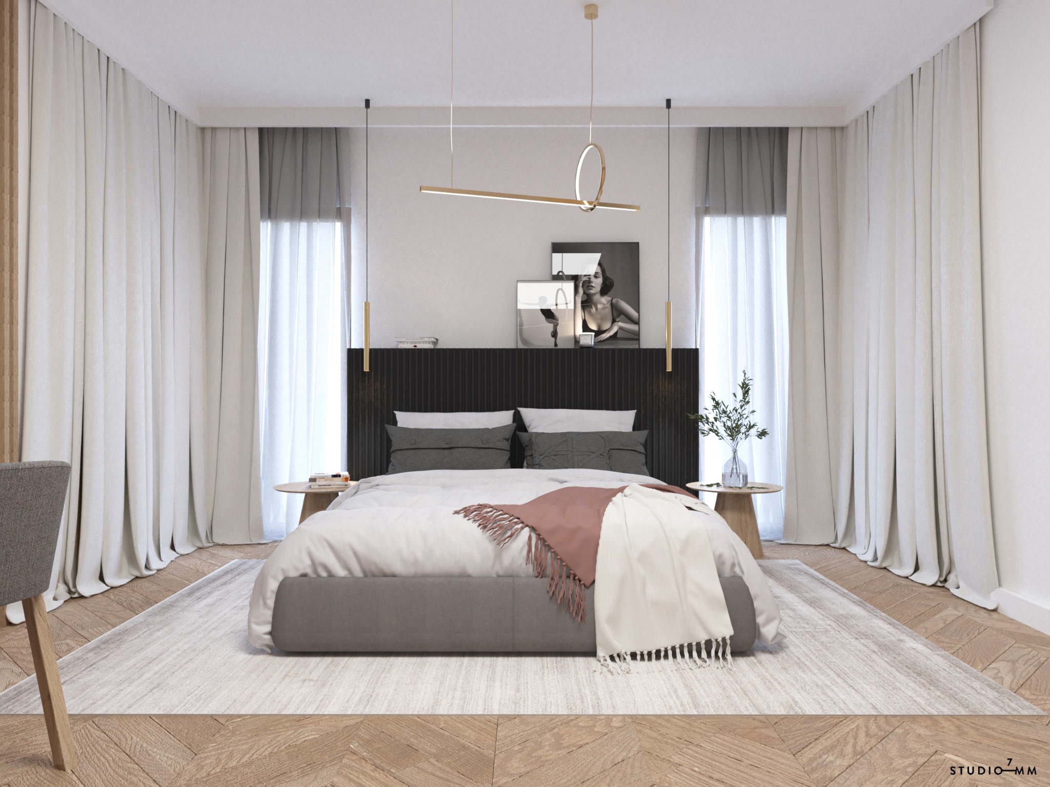 Nowoczesna sypialnia z łóżkiem kontynentalnym, drewnianą podłogą ułożoną w jodełkę i minimalistycznym oświetleniem, uzupełniona o dekoracyjne poduszki i pled oraz czarno-białą fotografię na ścianie.