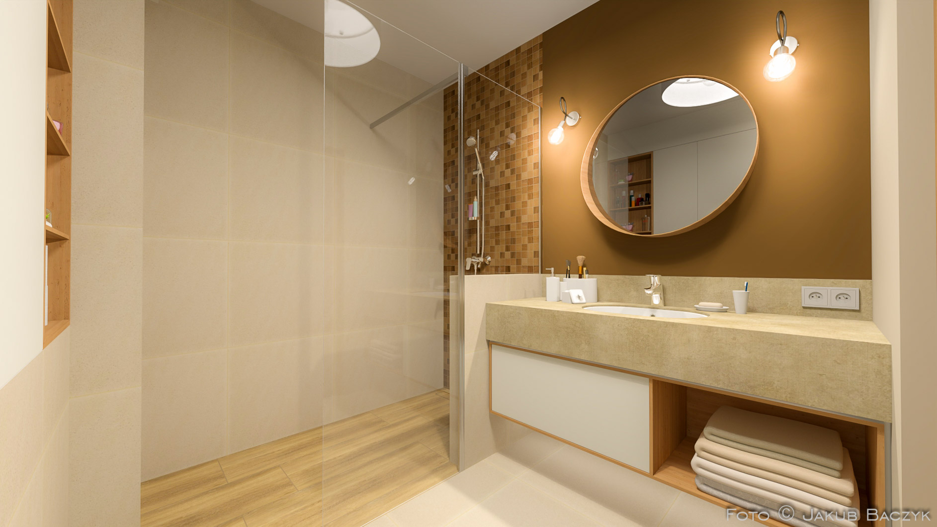 Nowoczesna łazienka z kabiną prysznicową typu walk-in, umywalką z blatem imitującym kamień, okrągłym lustrem i mozaiką na ścianie w strefie prysznica.