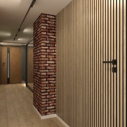 Flormeb - Nowoczesny przedpokój z akcentem ceglanej kolumny i drewnianej ściany z pionowych paneli, oświetlenie punktowe na suficie, drewniana podłoga.