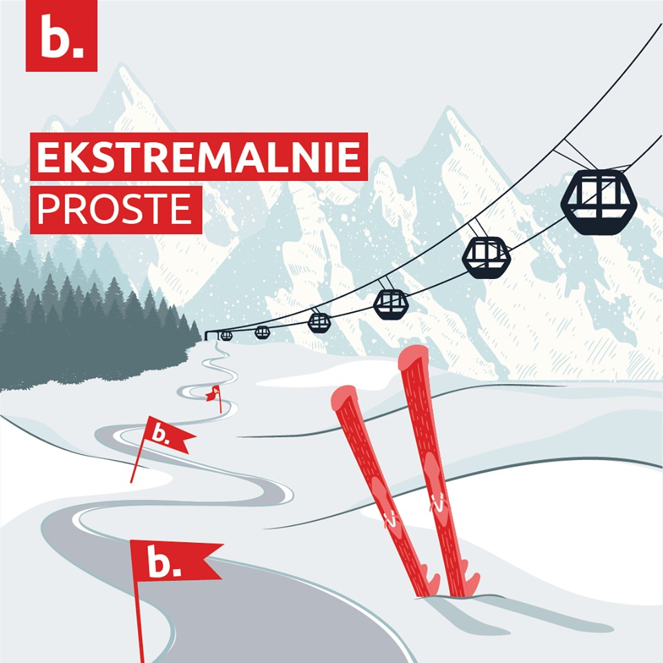 Ilustracja przedstawiająca stok narciarski z wyciągiem krzesełkowym, czerwonymi nartami wbitymi w śnieg, ośnieżonymi górami w tle oraz flagami z logo 'b.' wzdłuż trasy, z napisem 'EKSTREMALNIE PROSTE'