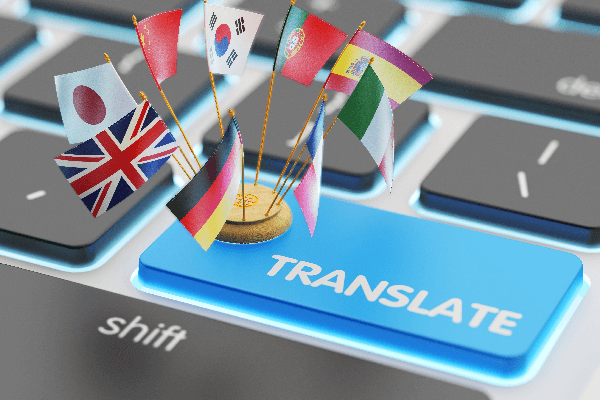 Klawiatura komputera z niebieskim klawiszem 'Translate' i zestawem flag różnych krajów (Japonia, Wielka Brytania, Niemcy, Chiny, Korea Południowa, Portugalia, Hiszpania, Francja) umieszczonych...