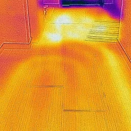 Termowizyjne zdjęcie podłogi z zaznaczonymi strefami ciepła, prawdopodobnie ogrzewania podłogowego, widoczne schody w tle.