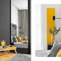 Nowoczesna sypialnia z szarą tapicerowaną ścianą za łóżkiem, żółtymi akcentami w postaci poduszek i koca, drewnianą tacą śniadaniową z rogalikami i sokiem oraz dekoracyjną lampą ścienną i wysokim...